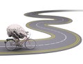 Human brain with arms and legs on bicycle on the road