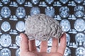 Human brain in hand on a background of MRI. Series of CAT Scans showing the human head Royalty Free Stock Photo