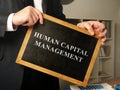 Human capital management HCM written on the blackboard Royalty Free Stock Photo