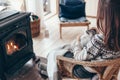 Human with cat relaxing by the fire place Royalty Free Stock Photo