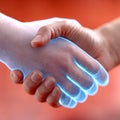 Human and digital hand shaking in a futuristic digital connection Royalty Free Stock Photo