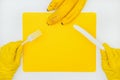 Human eats his lunch. At the table is a white plate, knife, fork, bananas. View from above.