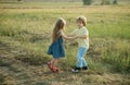 Human emotions - kids first love. Romantic and love. Childhood concept. Beautiful little couple - boy and girl embracing Royalty Free Stock Photo