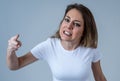 Human expressions and emotions. Desperate young attractive woman with angry face looking furious Royalty Free Stock Photo