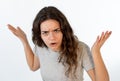 Human expressions and emotions. Portrait of young furious girl with angry face isolated on white Royalty Free Stock Photo