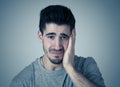 Human expressions, emotions. Young attractive man with sad face, looking depressed and unhappy Royalty Free Stock Photo