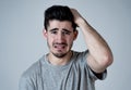 Human expressions, emotions. Young attractive man with sad face, looking depressed and unhappy Royalty Free Stock Photo