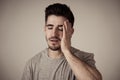 Human expressions, emotions. Young attractive man with sad face, looking depressed and unhappy Royalty Free Stock Photo