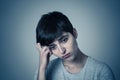 Human expressions and emotions. Young attractive woman with a sad face, looking down hopeless Royalty Free Stock Photo