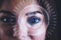 Human eye recognition face ID scanning process. Close up of white woman with digital interface. Royalty Free Stock Photo