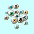 Human eyeballs iris pupils isolated on blue background - blue yellow brown green colors.