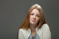 Human face expressions and emotions. Portrait of young adorable redhead woman in cozy shirt looking cute and calm