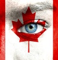 Human face painted with flag of Canada Royalty Free Stock Photo