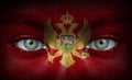 Human face painted with flag of Montenegro