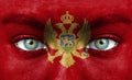 Human face painted with flag of Montenegro