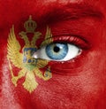 Human face painted with flag of Montenegro