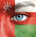 Human face painted with flag of Oman