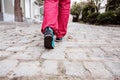 Human Feet walking on old paved Road Royalty Free Stock Photo