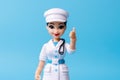 Human female doctor cartoon character with stethoscope, looking at camera. Clip art isolated on blue background Royalty Free Stock Photo
