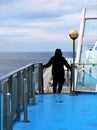 Human figure from behind descending the external stairs on a ferry Royalty Free Stock Photo