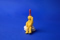 Human figure made of yellow plasticine with exclamation mark as solution idea on blue background Royalty Free Stock Photo
