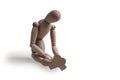 Human figurine depicting a lonely bored person, the concept of abandonment and uselessness