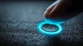 Human finger pressing glowing blue illuminated touch button on textured dark surface symbolizing digital interaction and Royalty Free Stock Photo