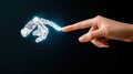 Human finger touching a glowing robotic hand on a dark background Royalty Free Stock Photo
