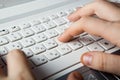 Human fingers on the notebook keyboard Royalty Free Stock Photo