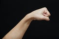 Human fist isolated in a black background Royalty Free Stock Photo