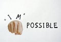 human fist punching impossible to possible words on white paper Royalty Free Stock Photo