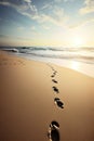 Human footprints walking on the beach. Generative AI