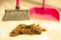 Human hair after cutting on the floor of a barber shop. Hairdresser sweeping hair clippings on floor in beauty salon Royalty Free Stock Photo