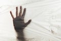 Human hand on background of plastic trash polluting planet. Stop the use of plastic packaging and bags Royalty Free Stock Photo