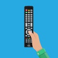 Human hand with black modern remote TV Control Royalty Free Stock Photo