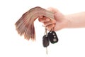 Human hand with cash and car keys Royalty Free Stock Photo