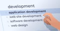human hand choosing development in search bar on virtual screen application development internet networking Royalty Free Stock Photo