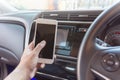 Human hand conecting smart phone and car. Royalty Free Stock Photo
