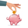 Human hand depositing coin in a money piggy bank Royalty Free Stock Photo