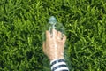 Human hand in empty plastic bottle.