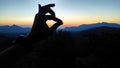 Human hand fingers silhouette on hills