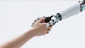 Human Hand Touching Robotic Hand in AI Interaction Royalty Free Stock Photo