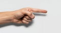 Human Hand Gesture Pointing Forward on Clean White Background Demonstrating Direction and Choice Royalty Free Stock Photo