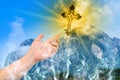 Human hand hold christian cross on blue sky. Religion Royalty Free Stock Photo