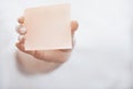 Human hand holding adhesive note Royalty Free Stock Photo