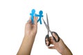 Human hand holding blue people paper and scissor