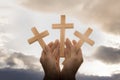 Human hand holding a cross, the background is the sunrise., Concept for Christian, Christianity, Catholic religion, divine, heave Royalty Free Stock Photo