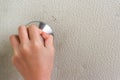 Human hand holding Door knob to open into the house. Royalty Free Stock Photo