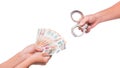 Human hand holding euro money and handcuffs. Fan of euro banknotes. Royalty Free Stock Photo