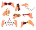 Human hand holding eyewear glasses protecting from sun and for eyesight vision correction set